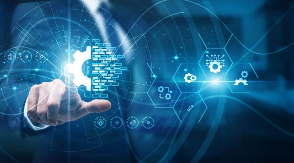 Homme en costume interagissant avec une interface numérique affichant des icônes de rouages et de connexions technologiques